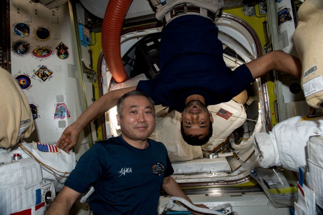 iss068e067540 (March 4, 2023) --- From left, Expedition 68 Flight Engineers Koichi Wakata of JAXA (Japan Aerospace Exploration Agency) and Sultan Alneyadi of UAE (United Arab Emirates) pose for a portrait inside the International Space Station's Quest airlock.
