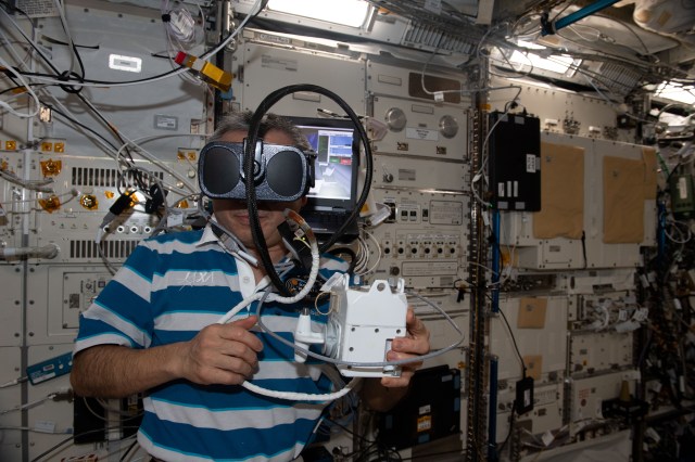 iss068e040441 (Jan. 13, 2023) --- Expedition 68 Flight Engineer Koichi Wakata of the Japan Aerospace Exploration Agency (JAXA) wears virtual reality goggles and practices for the unlikely emergency scenario of becoming untethered from the International Space Station during a spacewalk. The virtual training familiarizes astronauts with operating the jet pack attached to their Extravehicular Mobility Units, or spacesuits, to safely return to the orbiting lab in the event they become detached during a spacewalk. The jet pack is also known by its longer name Simplified Aid for EVA Rescue, or SAFER.