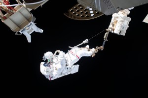 Astronaut Luca Parmitano of ESA (European Space Agency) is attached to an articulating portable foot restraint at the end of the Canadarm2 robotic arm during the second spacewalk to repair the International Space Station's cosmic particle detector, the Alpha Magnetic Spectrometer.
