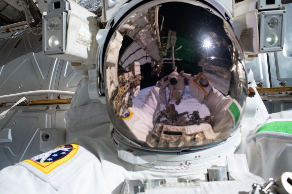 ESA (European Space Agency) astronaut Luca Parmitano points his camera toward his U.S. helmet with the reflective visor down and takes a "space-selfie" during the third spacewalk to upgrade the Alpha Magnetic Spectrometer's thermal pump system.