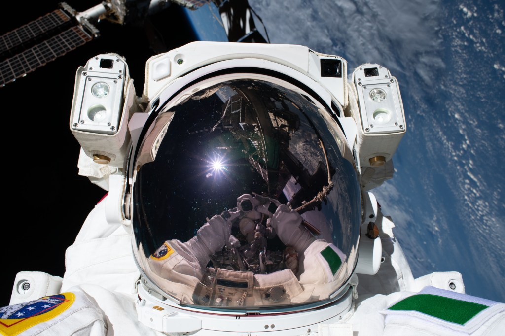 Astronaut Luca Parmitano of ESA (European Space Agency) takes an out-of-this-world "space-selfie" with his spacesuit's helmet visor down during the second spacewalk to repair the International Space Station's cosmic particle detector, the Alpha Magnetic Spectrometer.