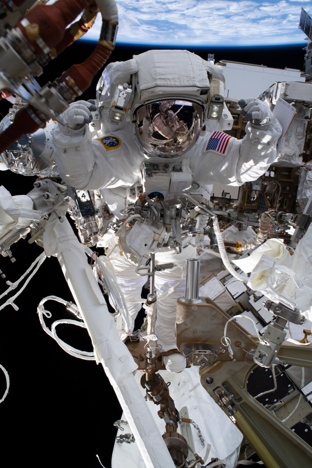iss068e041225 (Jan. 20, 2023) --- NASA astronaut and Expedition 68 Flight Engineer Nicole Mann is pictured in her Extravehicular Mobility Unit, or spacesuit, during her first spacewalk. She and fellow spacewalker Koichi Wakata (out of frame) of the Japan Aerospace Exploration Agency installed a modification kit on the International Space Station's starboard truss structure that will enable the future installation of the orbiting lab's next roll-out solar array.