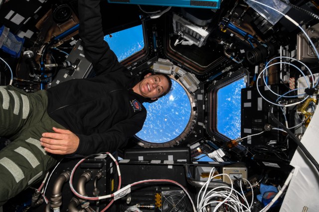 iss068e025351 (Nov. 27, 2022) --- NASA astronaut and Expedition 68 Flight Engineer Nicole Mann is pictured inside the seven-window cupola as the SpaceX Dragon cargo craft approaches the International Space Station for a docking.