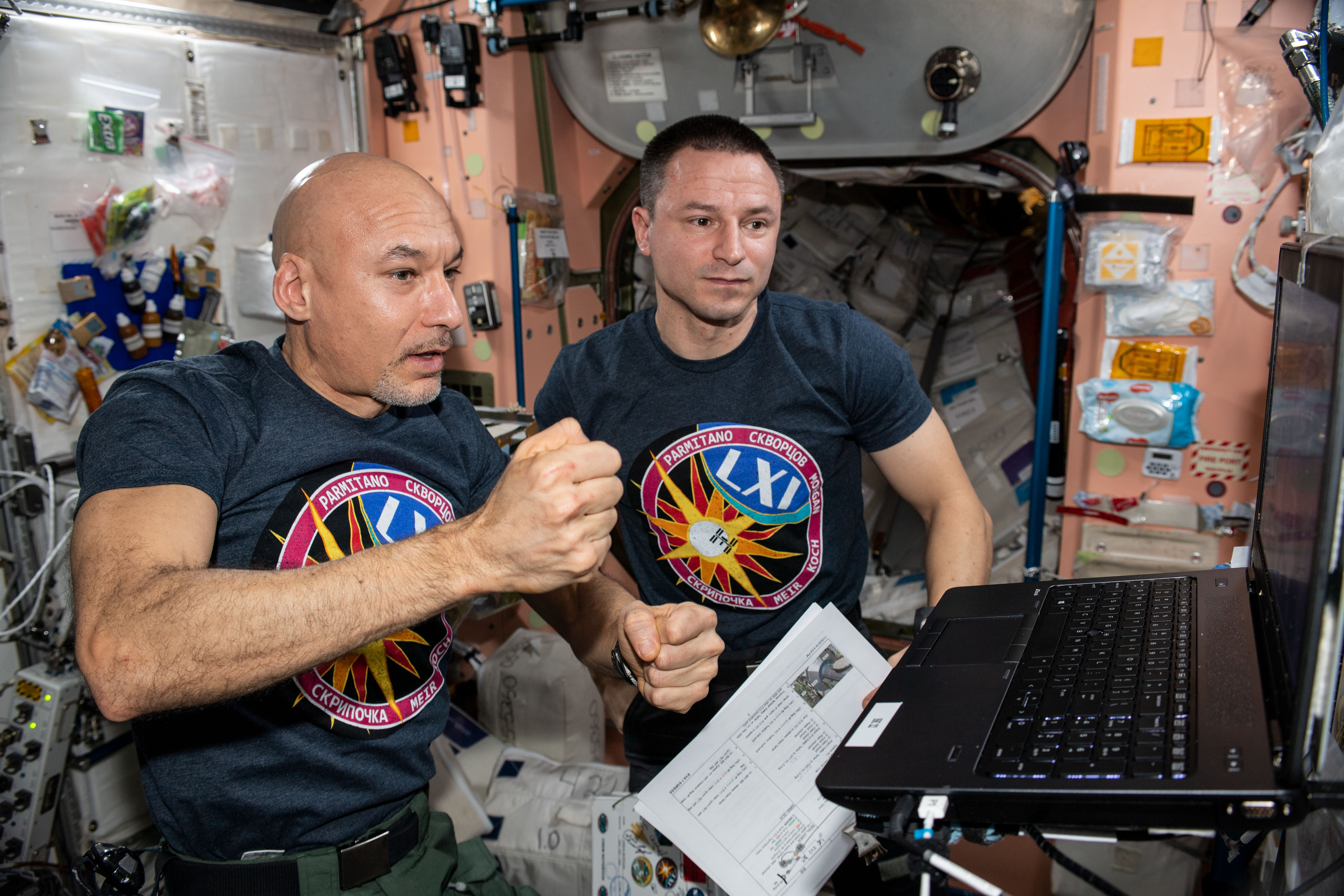 Astronauts Luca Parmitano (left) and Andrew Morgan review robotics procedures in the U.S. Destiny laboratory module. Astronaut Jessica Meir will operate the Canadarm2 robotic arm to support the duo during a series of spacewalks to repair the International Space Station's cosmic particle detector, the Alpha Magnetic Spectrometer (AMS).