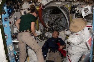 iss068e040436 (Jan. 12, 2023) --- Expedition 68 Flight Engineers Nicole Mann of NASA and Koichi Wakata of the Japan Aerospace Exploration Agency (JAXA) are pictured working on Extravehicular Mobility Units (EMUs), or spacesuits, inside the International Space Station's Quest airlock.