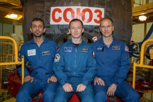 In the Integration Building at the Baikonur Cosmodrome in Kazakhstan, backup spaceflight participant Sultan Al-Neyadi of the United Arab Emirates (left) and backup Expedition 61 crewmates Sergey Ryzhikov of Roscosmos (center) and Tom Marshburn of NASA (right) pose for pictures Sept. 11 in front of the Soyuz MS-15 spacecraft. They are the backups to the prime crew, spaceflight participant Hazzaa Ali Almansoori of the United Arab Emirates and Expedition 61 crewmembers Oleg Skripochka of Roscosmos and Jessica Meir of NASA, who will launch Sept. 25 on the Soyuz MS-15 spacecraft from the Baikonur Cosmodrome for a mission on the International Space Station.