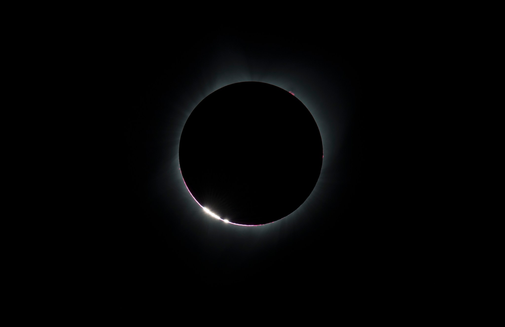 The Bailey's Beads effect is seen as the moon makes its final move over the sun during the total solar eclipse on Monday, August 21, 2017 above Madras, Oregon. A total solar eclipse swept across a narrow portion of the contiguous United States from Lincoln Beach, Oregon to Charleston, South Carolina. A partial solar eclipse was visible across the entire North American continent along with parts of South America, Africa, and Europe.