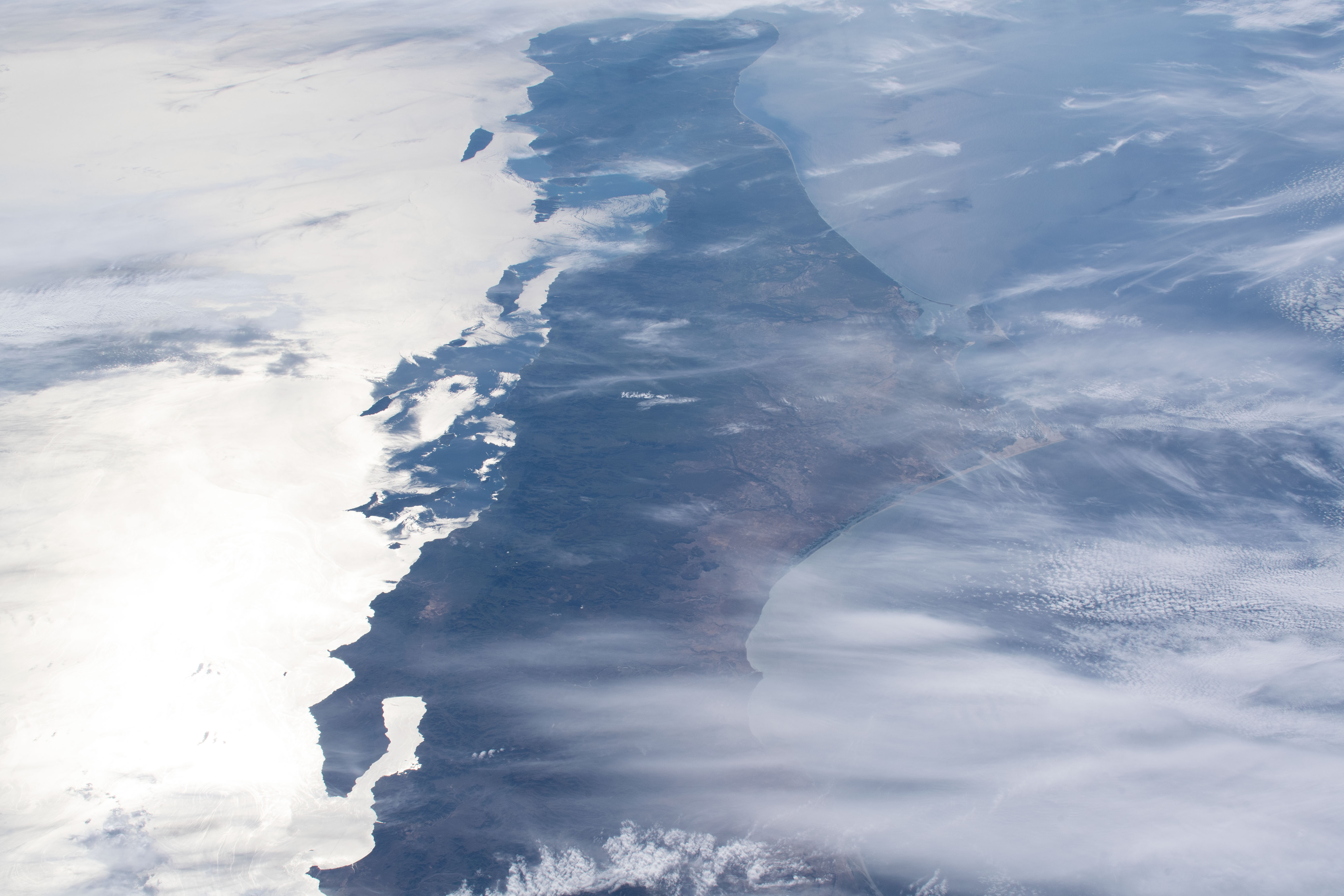 Baja California, with the Sun's glint beaming off the Gulf of California, is pictured as the International Space Station orbited 256 miles above the Pacific Ocean southwest of Tijuana, Mexico.