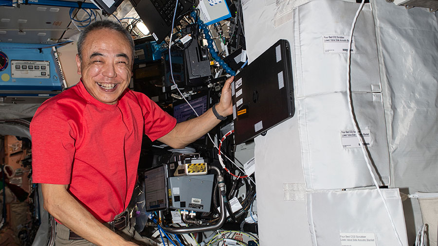 JAXA astronaut Satoshi Furukawa works on carbon dioxide removal hardware inside the Destiny laboratory module.