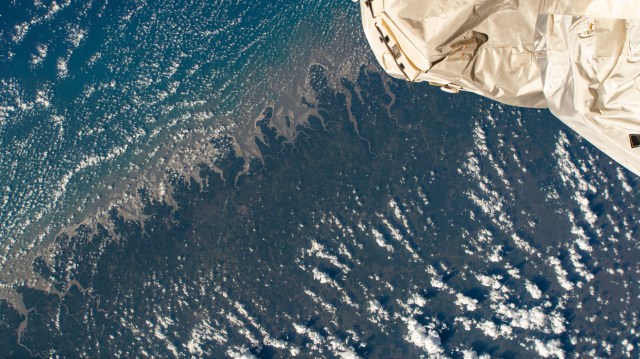 The International Space Station was orbiting above Brazil when an external high-definition camera pictured the Marine Extractive Reserve of Tracuateua near the mouth of the Amazon River located on the northeast coast of the South American nation.