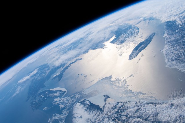 Canada's sun glint-lit Gulf of St. Lawrence and its coastal states of Nova Scotia, New Brunswick, Prince Edward Island and portions of Newfoundland are pictured as the International Space Station orbited nearly 258 miles above the North Atlantic Ocean.