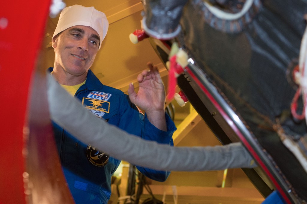At the Baikonur Cosmodrome in Kazakhstan, Expedition 63 crewmember Chris Cassidy of NASA prepares to enter the Soyuz MS-16 spacecraft March 25 as part of pre-launch training activities. Cassidy and Anatoly Ivanishin and Ivan Vagner of Roscosmos will launch April 9 on the Soyuz from Baikonur for a six-and-a-half month mission on the International Space Station. Credit: Andrey Shelepin/Gagarin Cosmonaut Training Center.