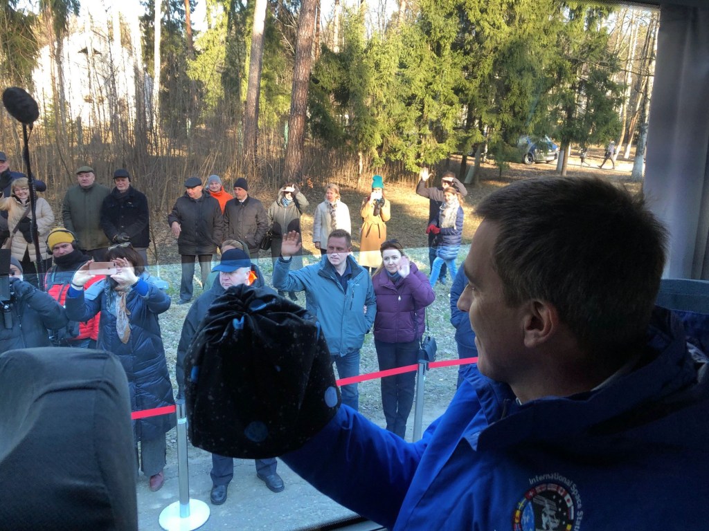 jsc2020e016838 (March 24, 2020) - At the Gagarin Cosmonaut Training Center in Star City, Russia, NASA astronaut Chris Cassidy waves to well-wishers March 24 as he departs with his crewmates for their launch site at the Baikonur Cosmodrome in Kazakhstan. Cassidy and Anatoly Ivanishin and Ivan Vagner of Roscosmos will launch April 9 on the Soyuz MS-16 spacecraft from the Baikonur Cosmodrome for a six-and-a-half month mission on the International Space Station.