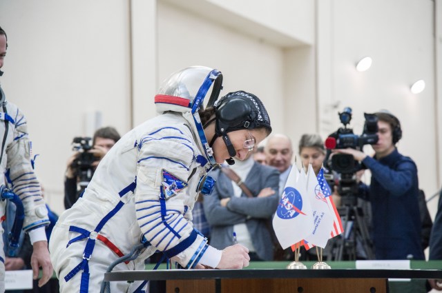 At the Gagarin Cosmonaut Training Center in Star City, Russia, Expedition 59 crew member Christina Koch of NASA signs in for the second day of final pre-launch qualification exams Feb. 20. Koch, Nick Hague of NASA and Alexey Ovchinin of Roscosmos will launch March 14, U.S. time, in the Soyuz MS-12 spacecraft from the Baikonur Cosmodrome in Kazakhstan for a six-and-a-half month mission on the International Space Station.