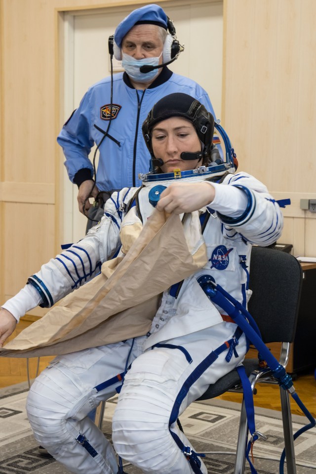 At the Baikonur Cosmodrome in Kazakhstan, Expedition 59 crew member Christina Koch of NASA suits up for a Soyuz fit check dress rehearsal Feb. 27 during pre-launch training. Koch, Nick Hague of NASA and Alexey Ovchinin of Roscosmos will launch March 14, U.S. time, on the Soyuz MS-12 spacecraft from the Baikonur Cosmodrome in Kazakhstan for a six-and-a-half month mission on the International Space Station.