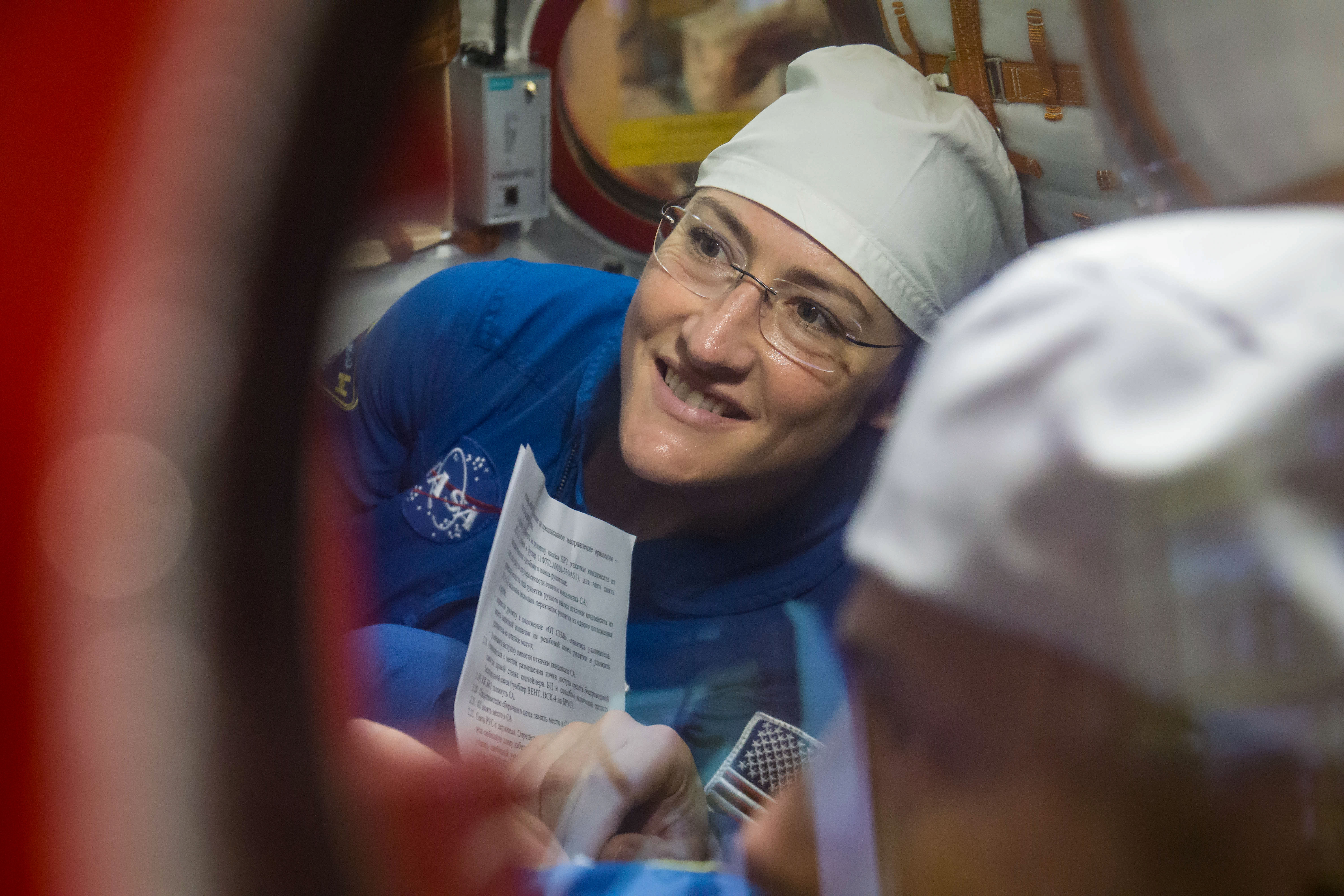 At the Baikonur Cosmodrome in Kazakhstan, Expedition 59 crew member Christina Koch of NASA works inside the Soyuz MS-12 spacecraft Feb. 27 during pre-launch training. Koch, Alexey Ovchinin of Roscosmos and Nick Hague of NASA (right) will launch March 14, U.S. time, on the Soyuz MS-12 spacecraft from the Baikonur Cosmodrome in Kazakhstan for a six-and-a-half month mission on the International Space Station.