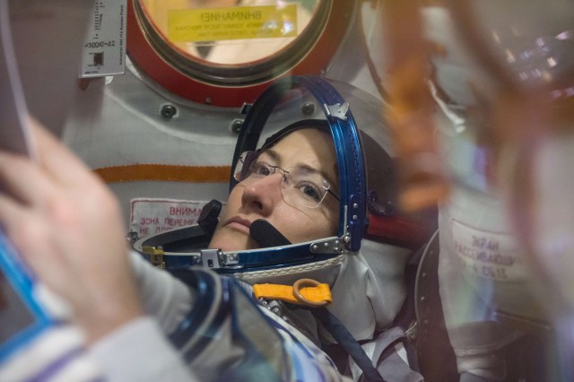 At the Baikonur Cosmodrome in Kazakhstan, Expedition 59 crew member Christina Koch of NASA works inside the Soyuz MS-12 spacecraft Feb. 27 during pre-launch training. Koch, Alexey Ovchinin of Roscosmos and Nick Hague of NASA (right) will launch March 14, U.S. time, on the Soyuz MS-12 spacecraft from the Baikonur Cosmodrome in Kazakhstan for a six-and-a-half month mission on the International Space Station.