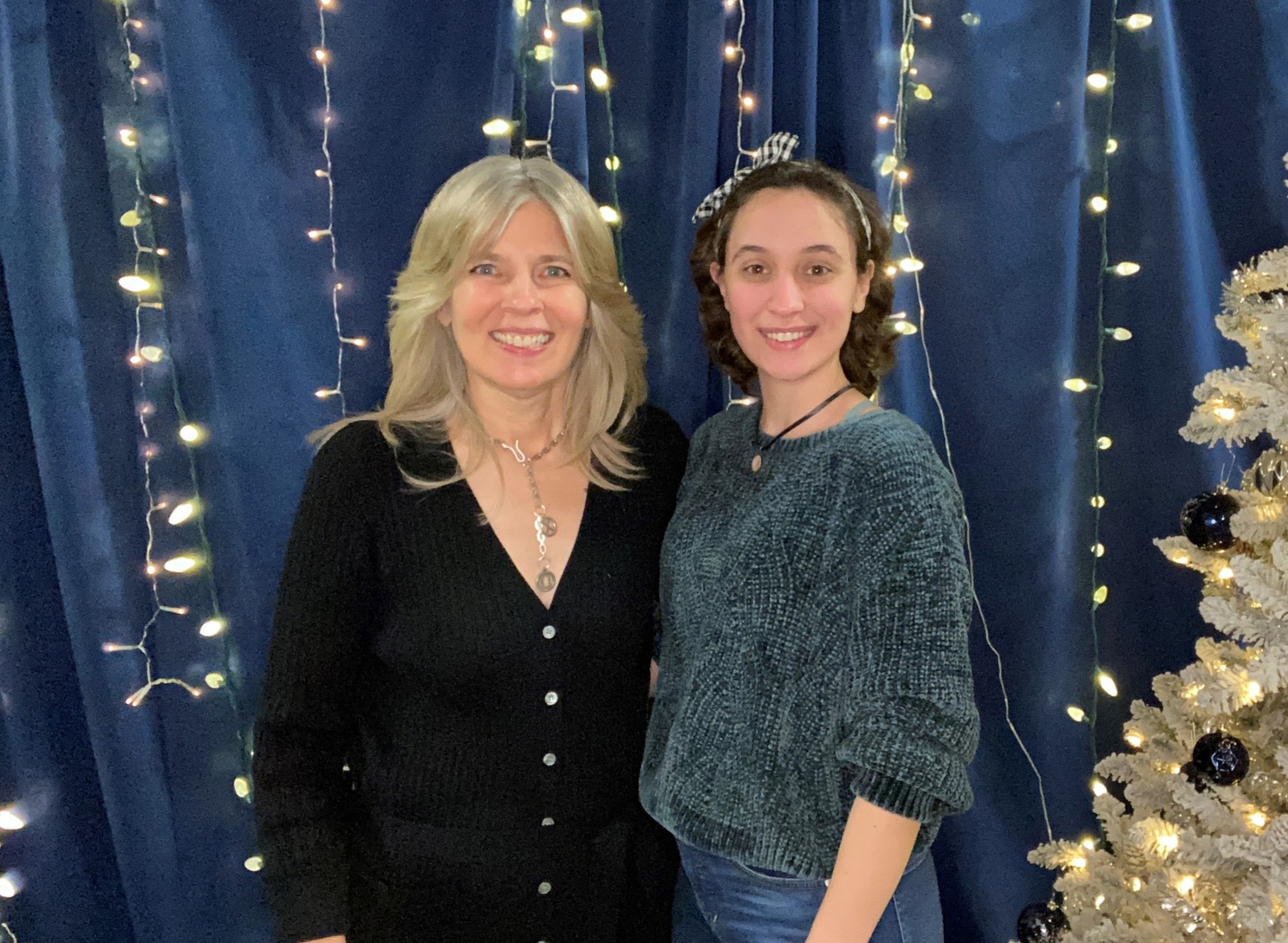 Mentor and Michoud Assembly Facility integrations lead Cynthia Spraul, left, smiles with mentee, Marie Allain, project coordinator, at a holiday party in 2022.