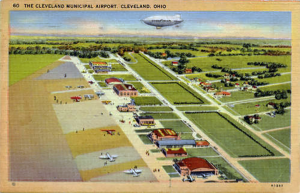 Illustration of blimp floating over airport.