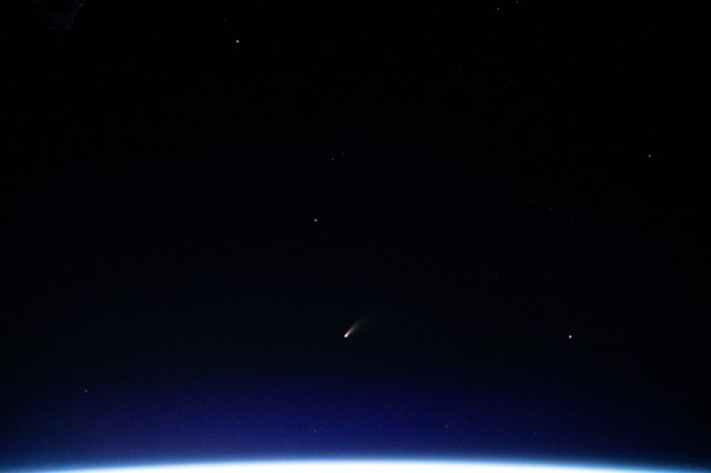 The tiny shooting star in the lower center of this image is Comet Neowise pictured from the International Space Station as it orbited above the Mediterranean Sea in between Tunisia and Italy.