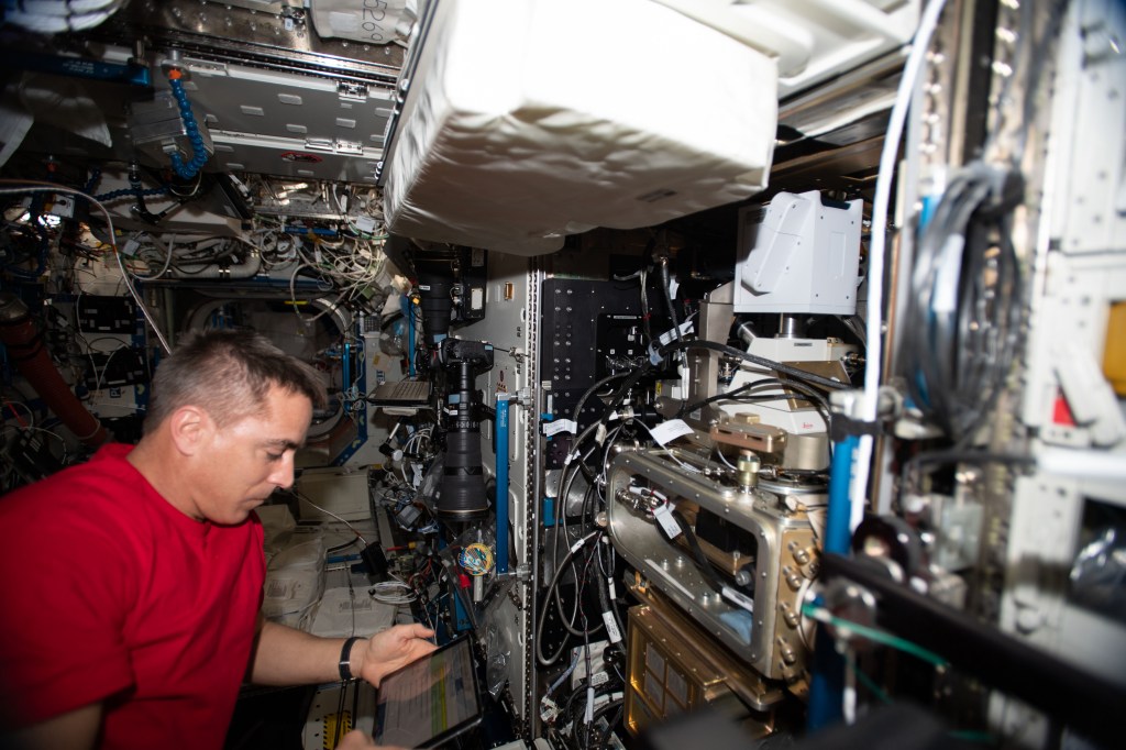 NASA astronaut and Expedition 63 Commander Chris Cassidy works on the Fluids Integrated Rack (FIR) replacing components in the research device that studies the behavior of fluids in microgravity. The FIR will help promote the design of advanced space-based fuel tanks and other complex fluid transfer systems.
