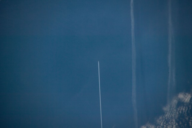 258 miles above the North Atlantic Ocean an Expedition 59 crewmember photographed the contrail of an aircraft flying below as the International Space Station approached the coast of Ireland.