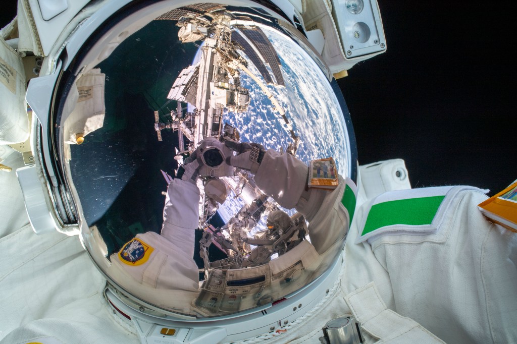 ESA (European Space Agency) astronaut Luca Parmitano takes an out-of-this-world "space-selfie" with his spacesuit's helmet visor down during the first spacewalk to repair the Alpha Magnetic Spectrometer, the International Space Station's cosmic particle detector.