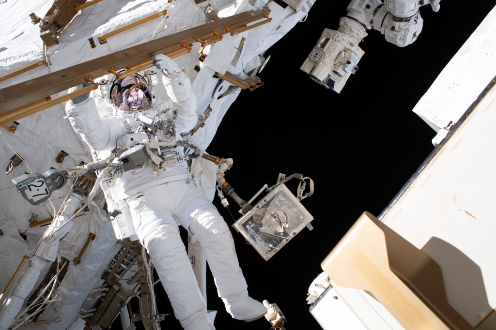 ESA (European Space Agency) astronaut Luca Parmitano is pictured tethered to the International Space Station while finalizing thermal repairs on the Alpha Magnetic Spectrometer, a dark matter and antimatter detector, during a spacewalk that lasted 6 hours and 16 minutes.