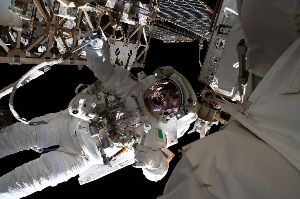 ESA (European Space Agency) astronaut Luca Parmitano is pictured tethered to the International Space Station while finalizing thermal repairs on the Alpha Magnetic Spectrometer, a dark matter and antimatter detector, during a spacewalk that lasted 6 hours and 16 minutes.