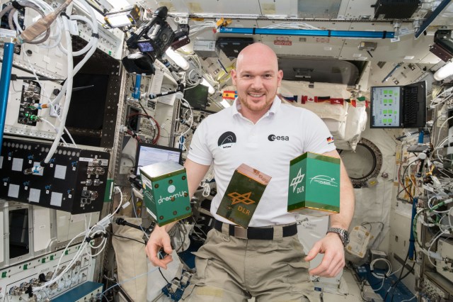 A view of European Space Agency (ESA) astronaut Alexander Gerst with the (ARISE) - NanoRacks Module-75, the Pump Application using Pulsed Electromagnets for Liquid reLocation (PAPELL) - NanoRacks Module-76 and the Experimental Chondrule Formation at the International Space Station (EXCISS) - NanoRacks Module-77 experiments shown in the Japanese Experiment Module (Kibo).