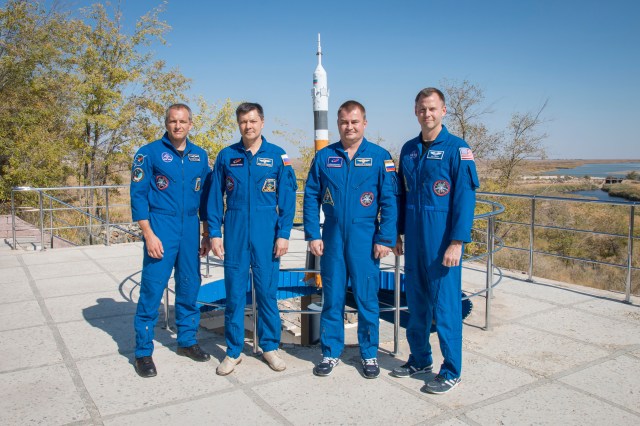 Expedition 57 backup and prime crew members pose for pictures in front of a model of a Soyuz rocket, Wednesday, Oct. 3, 2018 at the Cosmonaut Hotel crew quarters in Baikonur, Kazakhstan. From left are backup crew members David Saint-Jacques of the Canadian Space Agency and Oleg Kononenko of Roscosmos and prime crew members Alexey Ovchinin of Roscosmos and Nick Hague of NASA. Ovchinin and Hague are scheduled to launch on Oct. 11 onboard the Soyuz MS-10 spacecraft from the Baikonur Cosmodrome in Kazakhstan for a six-month mission on the International Space Station.