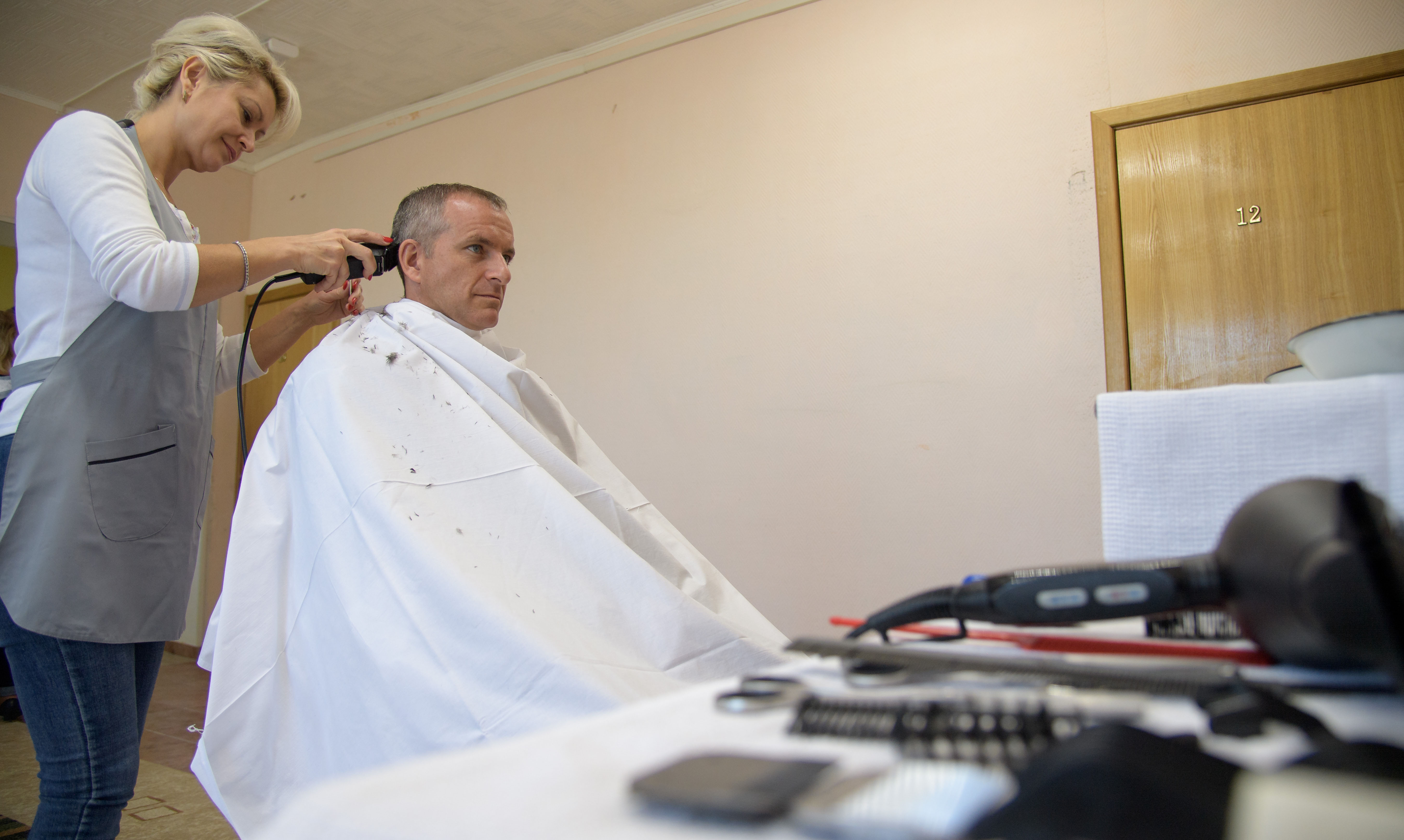 Expedition 57 backup crew member David Saint-Jacques of the Canadian Space Agency gets his hair cut, Tuesday, Oct. 9, 2018 at the Cosmonaut Hotel in Baikonur, Kazakhstan. Expedition 57 Flight Engineer Nick Hague of NASA and Flight Engineer Alexey Ovchinin of Roscosmos are scheduled to launch onboard a Soyuz rocket October 11 and will spend the next six months living and working aboard the International Space Station.