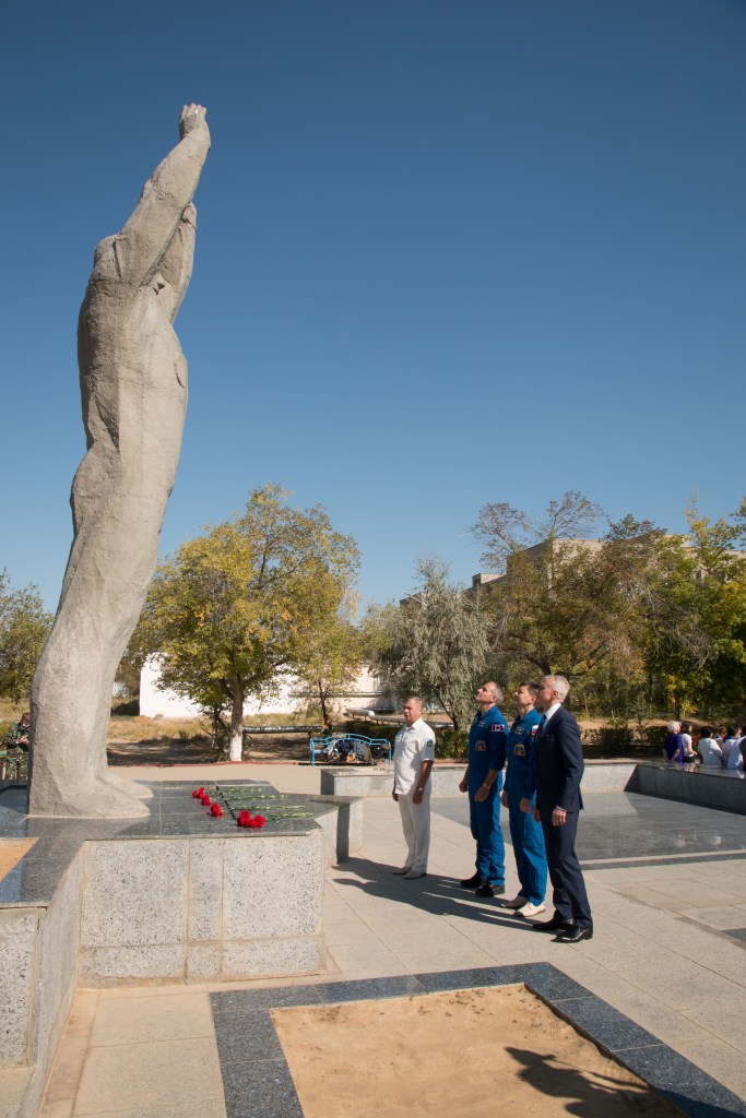 During a tour of the city of Baikonur, Kazakhstan, Expedition 57 backup crew members David Saint-Jacques of the Canadian Space Agency and Oleg Kononenko of Roscosmos pay homage to Yuri Gagarin, the first human to fly in space, as they laid flowers at his statue during traditional pre-launch ceremonies Sept. 27. They are the backups to the prime crew, Alexey Ovchinin of Roscosmos and Nick Hague of NASA, who will launch Oct. 11 on the Soyuz MS-10 spacecraft from the Baikonur Cosmodrome in Kazakhstan for a six-month mission on the International Space Station.