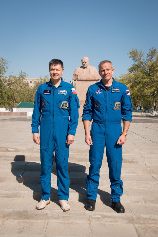 During a tour of the city of Baikonur, Kazakhstan, Expedition 57 backup crew members Oleg Kononenko of Roscosmos (left) and David Saint-Jacques of the Canadian Space Agency (right) pose for pictures Sept. 27 at the statue of Sergei Korolev, the Russian space designer icon, during traditional pre-launch ceremonies. They are the backups to the prime crew, Alexey Ovchinin of Roscosmos and Nick Hague of NASA, who will launch Oct. 11 on the Soyuz MS-10 spacecraft from the Baikonur Cosmodrome in Kazakhstan for a six-month mission on the International Space Station.