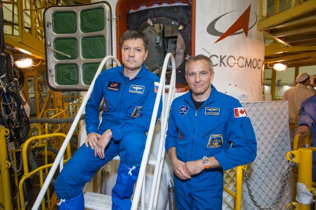 At the Baikonur Cosmodrome in Kazakhstan, Expedition 57 backup crewmembers Oleg Kononenko of Roscosmos (left) and David Saint-Jacques of the Canadian Space Agency (right) pose for pictures Oct. 6 in front of the Soyuz MS-10 spacecraft. They are the backups to the prime crewmembers, Alexey Ovchinin of Roscosmos and Nick Hague of NASA, who will launch Oct. 11 from the Baikonur Cosmodrome on the Soyuz MS-10 spacecraft for a six-month mission on the International Space Station.