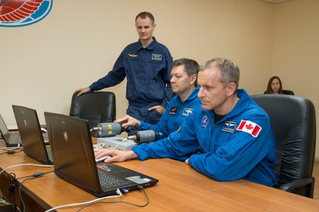 Expedition 57 backup crew members Oleg Kononenko of Roscosmos, left, and David Saint-Jacques of the Canadian Space Agency, right, practice rendezvous and docking procedures on a laptop training simulator as part of their pre-launch preparations, Wednesday, Oct. 3, 2018 at the Cosmonaut Hotel in Baikonur, Kazakhstan. Alexey Ovchinin of Roscosmos and Nick Hague of NASA are scheduled to launch on Oct. 11 onboard the Soyuz MS-10 spacecraft from the Baikonur Cosmodrome in Kazakhstan for a six-month mission on the International Space Station.