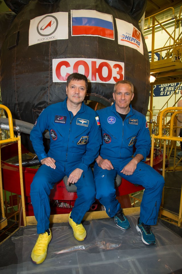 At the Baikonur Cosmodrome in Kazakhstan, Expedition 57 backup crew members Oleg Kononenko of Roscosmos and David Saint-Jacques of the Canadian Space Agency pose for pictures in front of the Soyuz MS-10 spacecraft Sept. 26 as part of pre-launch training. They are the backups to Alexey Ovchinin of Roscosmos and Nick Hague of NASA, who will launch Oct. 11 in the Soyuz MS-10 from the Baikonur Cosmodrome for a six-month mission on the International Space Station.