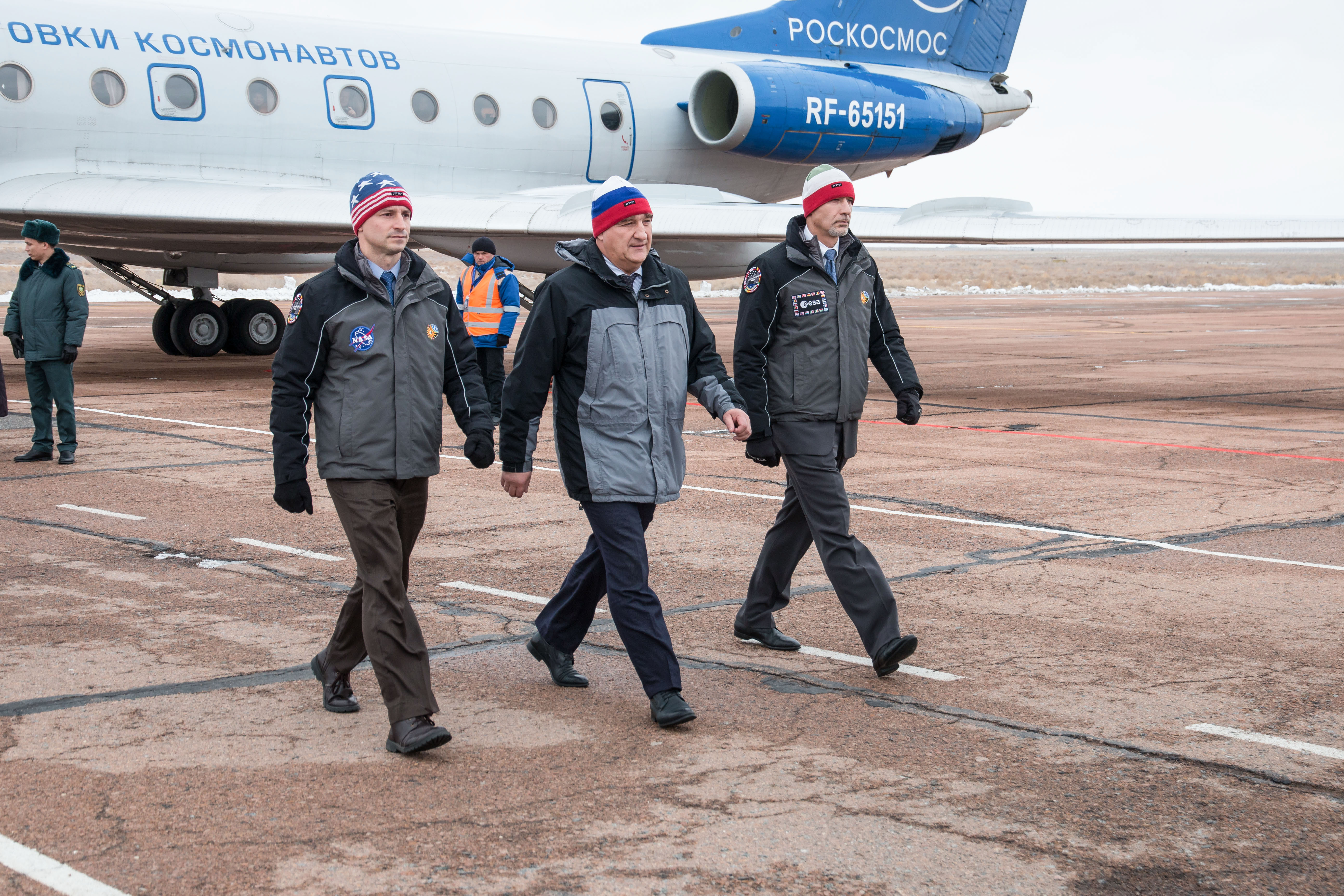 Expedition 59 backup crew members Drew Morgan of NASA (left), Alexander Skvortsov of Roscosmos (center) and Luca Parmitano of the European Space Agency (right) meet with Russian officials Feb. 26 after arriving at the Baikonur Cosmodrome in Kazakhstan for final pre-launch training following a flight from their training base in Star City, Russia. They are the backups to the prime crew, Nick Hague of NASA, Christina Koch of NASA and Alexey Ovchinin of Roscosmos, who will launch March 14, U.S. time, on the Soyuz MS-12 spacecraft from the Baikonur Cosmodrome in Kazakhstan for a six-and-a-half month mission on the International Space Station.