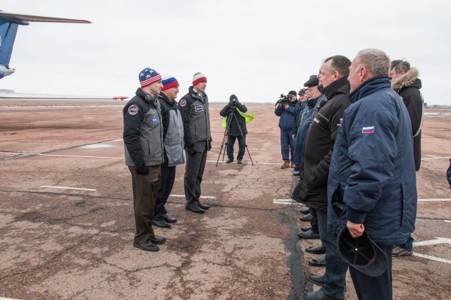 Expedition 59 backup crew members Drew Morgan of NASA (left), Alexander Skvortsov of Roscosmos (center) and Luca Parmitano of the European Space Agency (right) meet with Russian officials Feb. 26 after arriving at the Baikonur Cosmodrome in Kazakhstan for final pre-launch training following a flight from their training base in Star City, Russia. They are the backups to the prime crew, Nick Hague of NASA, Christina Koch of NASA and Alexey Ovchinin of Roscosmos, who will launch March 14, U.S. time, on the Soyuz MS-12 spacecraft from the Baikonur Cosmodrome in Kazakhstan for a six-and-a-half month mission on the International Space Station.