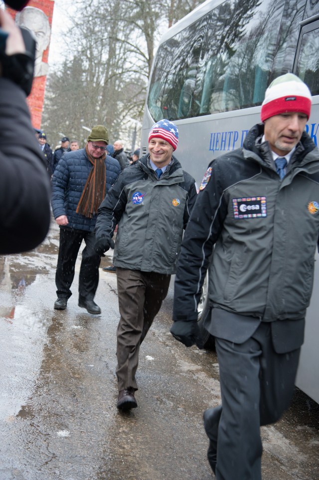 At the Gagarin Cosmonaut Training Center in Star City, Russia, Expedition 59 backup crew members Drew Morgan of NASA (center) and Luca Parmitano of the European Space Agency (right) walk to a bus Feb. 26 to take them to their plane for a flight to the Baikonur Cosmodrome in Kazakhstan for final pre-launch training. They and Alexander Skvortsov of Roscosmos are the backups to the prime crew, Nick Hague and Christina Koch of NASA and Alexey Ovchinin of Roscosmos, who will launch on March 14, U.S. time, on the Soyuz MS-12 spacecraft from the Baikonur Cosmodrome in Kazakhstan for a six-and-a-half month mission on the International Space Station.