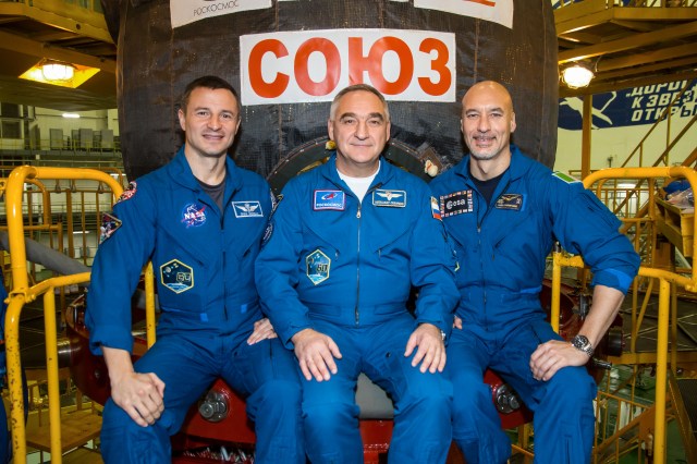 At the Baikonur Cosmodrome in Kazakhstan, Expedition 59 backup crew members (from left) Drew Morgan of NASA, Alexander Skvortsov of Roscosmos and Luca Parmitano of the European Space Agency (ESA) pose in front of the the Soyuz MS-12 spacecraft.