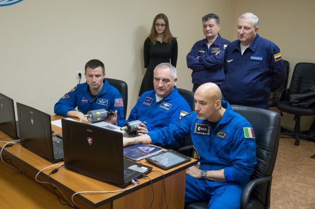 At their Cosmonaut Hotel crew quarters in Baikonur, Kazakhstan, Expedition 59 backup crew members Drew Morgan of NASA (left), Alexander Skvortsov of Roscosmos (center) and Luca Parmitano of the European Space Agency (right) rehearse rendezvous and docking techniques on a laptop computer simulator March 7 as they conduct pre-launch preparations. They are the backups to the prime crew members, Christina Koch of NASA, Alexey Ovchinin of Roscosmos and Nick Hague of NASA, who will launch March 14, U.S. time, on the Soyuz MS-12 spacecraft from the Baikonur Cosmodrome for a six-and-a-half month mission on the International Space Station.