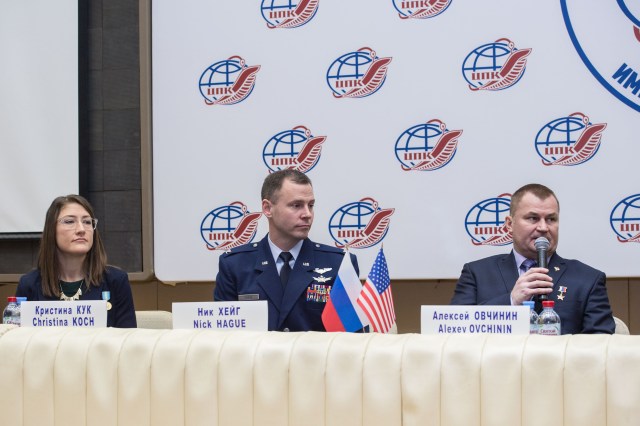 At the Gagarin Cosmonaut Training Center in Star City, Russia, Expedition 59 crew member Alexey Ovchinin of Roscosmos (right) responds to a reporter’s question Feb. 21 during a pre-launch news conference as crewmates Christina Koch of NASA (left) and Nick Hague of NASA (center) look on. They will launch March 14, U.S. time, on the Soyuz MS-12 spacecraft from the Baikonur Cosmodrome in Kazakhstan for a six-and-a-half month mission on the International Space Station.