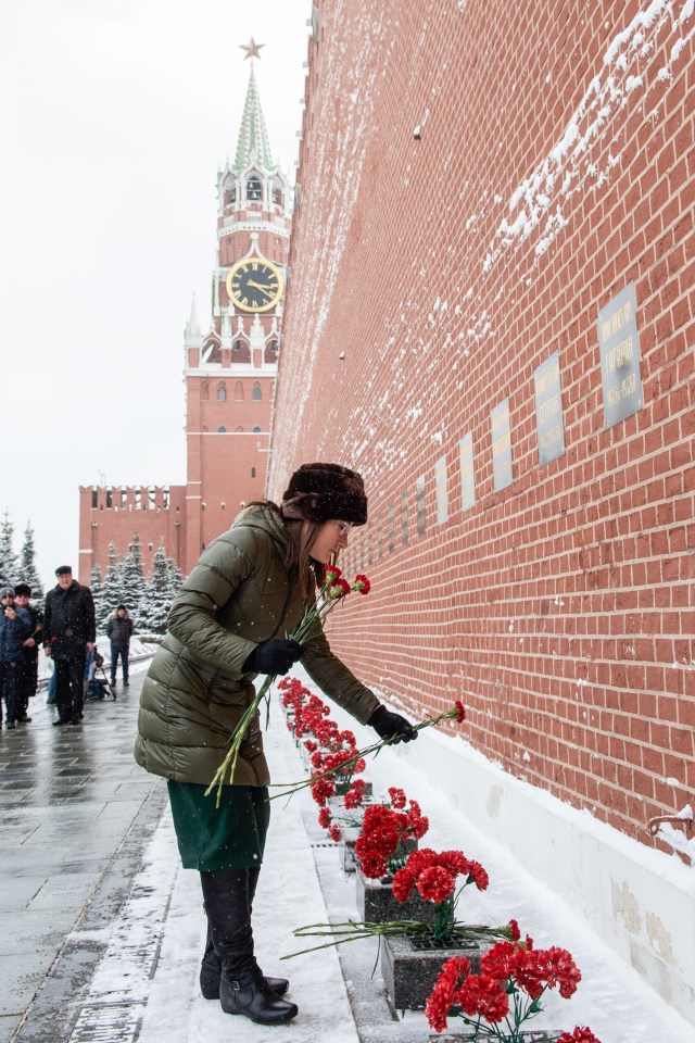 At the Kremlin Wall in Moscow, Expedition 59 crew member Christina Koch of NASA lays flowers where Russian space icons are interred in traditional ceremonies Feb. 21. Koch, Nick Hague of NASA and Alexey Ovchinin of Roscosmos will launch March 14, U.S. time, on the Soyuz MS-12 spacecraft from the Baikonur Cosmodrome in Kazakhstan for a six-and-a-half month mission on the International Space Station.