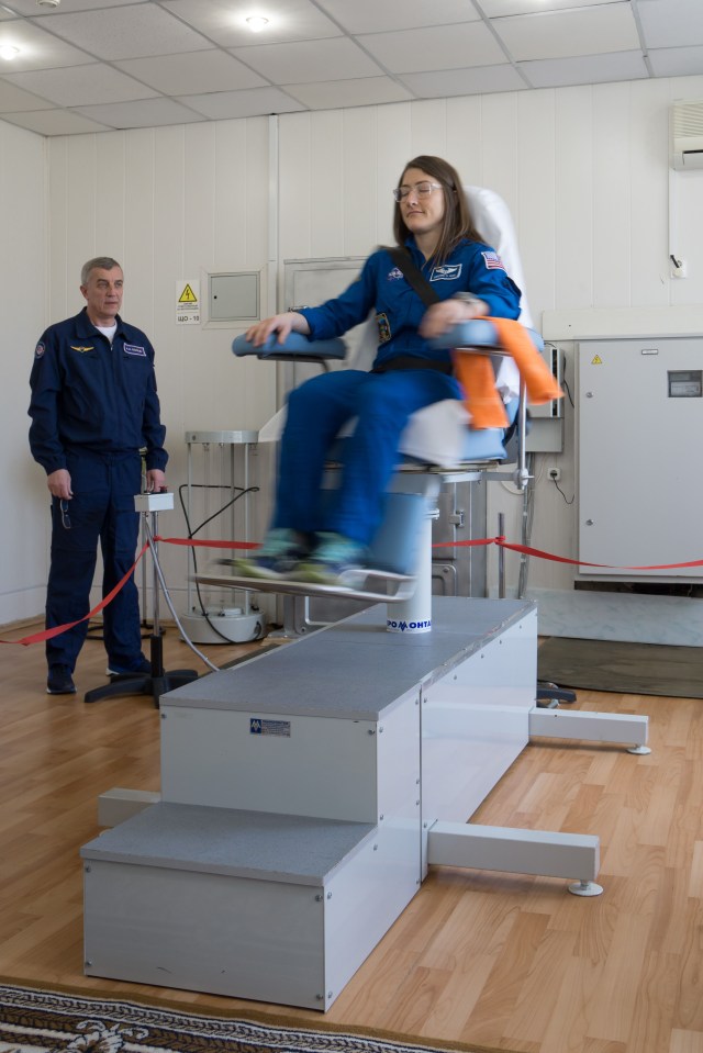 At the Cosmonaut Hotel crew quarters in Baikonur, Kazakhstan, Expedition 59 crew member Christina Koch of NASA tests her vestibular system in a rotating chair March 7 as part of her pre-launch activities. Koch, Alexey Ovchinin of Roscosmos and Nick Hague of NASA will launch March 14, U.S. time, on the Soyuz MS-12 spacecraft from the Baikonur Cosmodrome for a six-and-a-half month mission on the International Space Station.