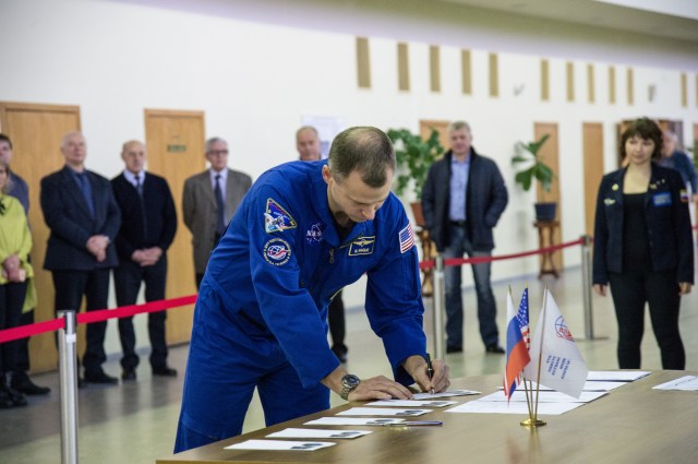 At the Gagarin Cosmonaut Training Center in Star City, Russia, Expedition 59 crew member Nick Hague of NASA signs in for the start of two days of final pre-launch qualification exams Feb. 19. Hague, Christina Koch of NASA and Alexey Ovchinin of Roscosmos will launch March 14, U.S. time, from the Baikonur Cosmodrome in Kazakhstan on the Soyuz MS-12 spacecraft for a six-and-a-half month mission on the International Space Station.