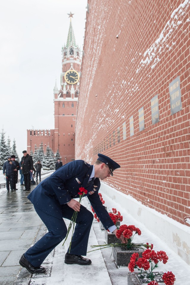 At the Kremlin Wall in Moscow, Expedition 59 crew member Nick Hague of NASA lays flowers where Russian space icons are interred in traditional ceremonies Feb. 21. Hague, Alexey Ovchinin of Roscosmos and Christina Koch of NASA will launch March 14, U.S. time, on the Soyuz MS-12 spacecraft from the Baikonur Cosmodrome in Kazakhstan for a six-and-a-half month mission on the International Space Station.