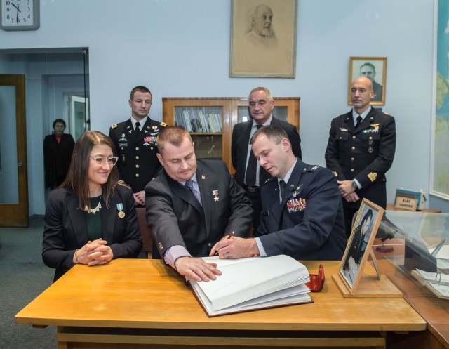 At the Gagarin Museum in the Gagarin Cosmonaut Training Center in Star City, Russia, Expedition 59 crew member Nick Hague of NASA (front, right) signs a ceremonial book Feb. 21 as part of the crew’s pre-launch activities as his crewmates, Christina Koch of NASA (left) and Alexey Ovchinin of Roscosmos (center) look on. In the back row are their backups, Drew Morgan of NASA, Alexander Skvortsov of Roscosmos and Luca Parmitano of the European Space Agency. Koch, Hague and Ovchinin will launch March 14, U.S. time, on the Soyuz MS-12 spacecraft from the Baikonur Cosmodrome in Kazakhstan for a six-and-a-half month mission on the International Space Station.
