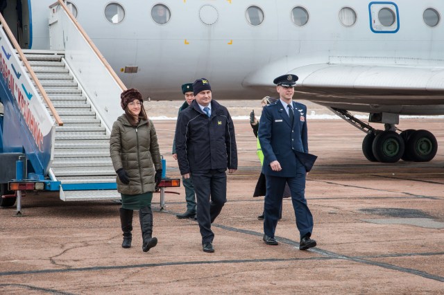 Expedition 59 crew members Christina Koch of NASA (left), Alexey Ovchinin of Roscosmos (center) and Nick Hague of NASA (right) arrive at the Baikonur Cosmodrome in Kazakhstan Feb. 26 for final pre-launch training following a flight from their training base at the Gagarin Cosmonaut Training Center in Star City, Russia. They will launch March 14, U.S. time, on the Soyuz MS-12 spacecraft from the Baikonur Cosmodrome in Kazakhstan for a six-and-a-half month mission on the International Space Station.