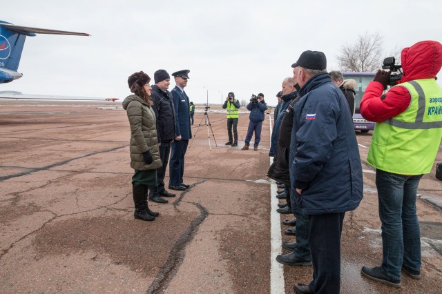 Expedition 59 crew members Christina Koch of NASA (left), Alexey Ovchinin of Roscosmos (center) and Nick Hague of NASA (right) meet with Russian space officials after arriving at the Baikonur Cosmodrome in Kazakhstan Feb. 26 for final pre-launch training following a flight from their training base at the Gagarin Cosmonaut Training Center in Star City, Russia. They will launch March 14, U.S. time, on the Soyuz MS-12 spacecraft from the Baikonur Cosmodrome in Kazakhstan for a six-and-a-half month mission on the International Space Station.